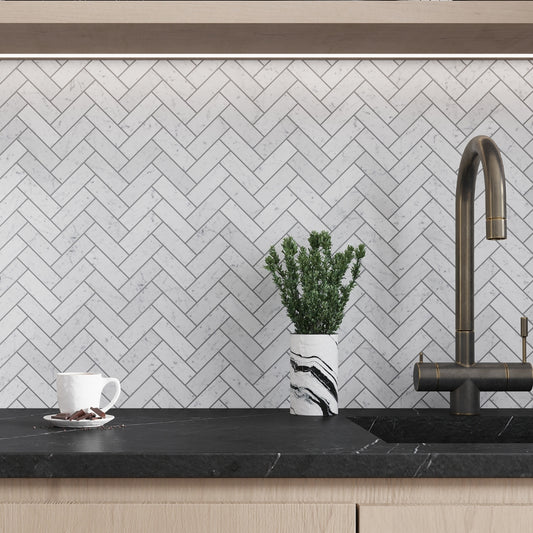 Marble herringbone backsplash behind a kitchen faucet in Farmington CT